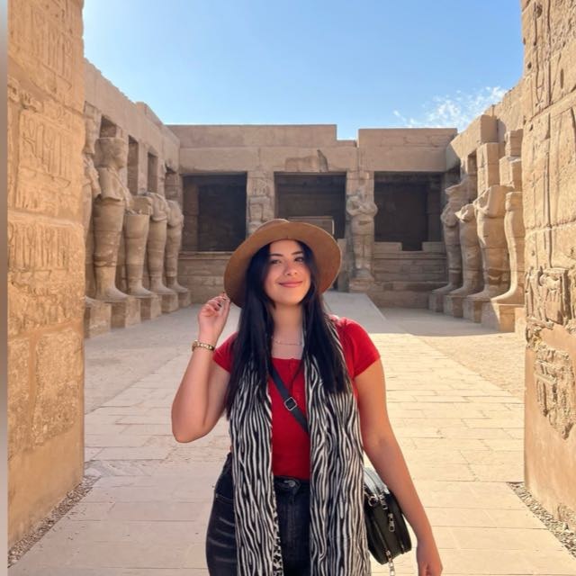 Madonaa smiling in a sun hat at Karnak Temple, Luxor